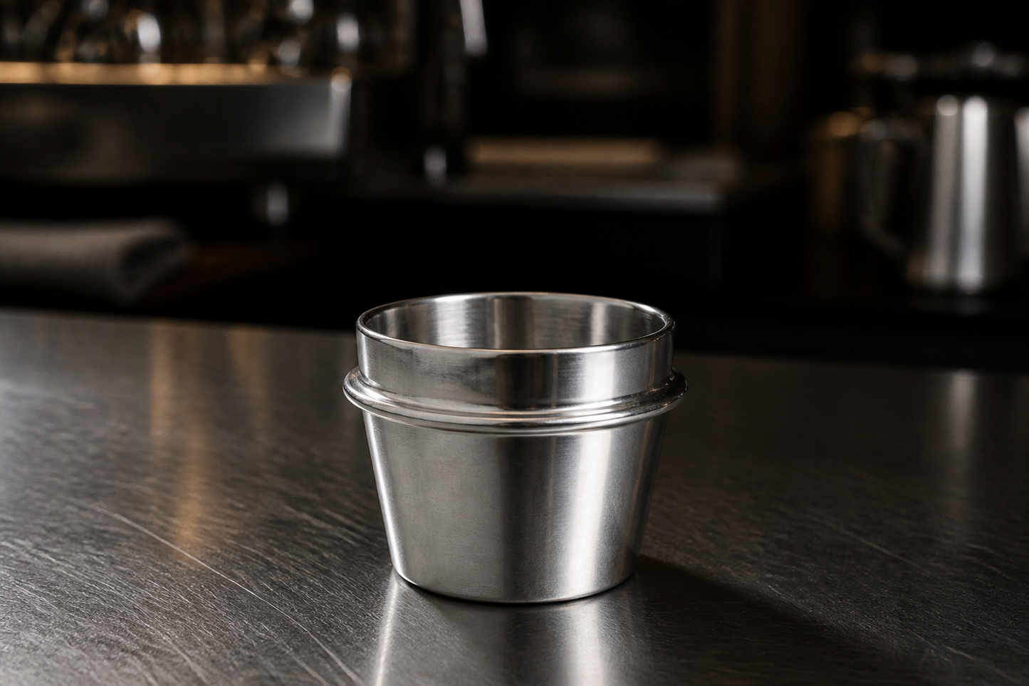 54 mm dosing cup on a steel bar