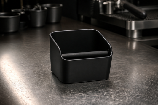Matte-black knock box on a steel bar